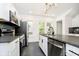Bright, modern kitchen with stainless steel appliances and ample counter space near a large window at 3370 N New Jersey St, Indianapolis, IN 46205