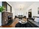 Spacious living room with hardwood floors, fireplace, and natural light, perfect for entertaining at 3370 N New Jersey St, Indianapolis, IN 46205