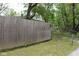 A tall wooden fence runs the length of the lot, providing privacy at 338 E Park St, Westfield, IN 46074