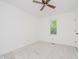 This bright bedroom is complemented by a ceiling fan and a window showcasing a tree at 3698 E 106Th St, Carmel, IN 46033