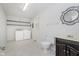 Functional laundry room with washer, dryer, shelves, and vanity at 3698 E 106Th St, Carmel, IN 46033
