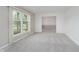Spacious living room with new carpeting and large windows providing ample natural light at 3698 E 106Th St, Carmel, IN 46033