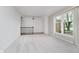 Bright living room with neutral carpet, large windows, and staircase with railing at 3698 E 106Th St, Carmel, IN 46033