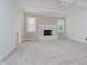Inviting living room with a classic white brick fireplace and a ceiling fan at 3698 E 106Th St, Carmel, IN 46033