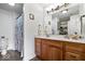 Bathroom featuring double sink vanity with wood cabinets and granite countertop at 4134 Bella Ct, Indianapolis, IN 46237