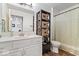 Well-lit bathroom with white cabinets, a marble countertop, and a shower-tub combination at 4134 Bella Ct, Indianapolis, IN 46237