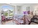 Bright bedroom featuring hardwood floors and a large arched window at 4134 Bella Ct, Indianapolis, IN 46237