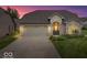 Charming brick home featuring an attached garage and manicured lawn, perfect for curb appeal at 4134 Bella Ct, Indianapolis, IN 46237