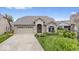 Well-maintained brick home boasts an attached garage, inviting entrance, and landscaped front yard at 4134 Bella Ct, Indianapolis, IN 46237