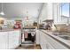 Bright kitchen featuring stainless steel appliances, a kitchen island, and granite countertops at 4134 Bella Ct, Indianapolis, IN 46237