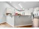 Bright kitchen featuring white cabinets and breakfast bar at 4134 Bella Ct, Indianapolis, IN 46237