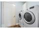 Laundry area with front-load washer and dryer set, and a door to another part of the home at 4134 Bella Ct, Indianapolis, IN 46237