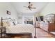 Inviting main bedroom with a ceiling fan, hardwood floors, and large windows at 4134 Bella Ct, Indianapolis, IN 46237
