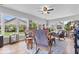 Bright sunroom with large windows offering ample natural light and serene views of the outdoors at 4134 Bella Ct, Indianapolis, IN 46237