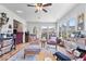 Relaxing sunroom featuring comfortable seating, a ceiling fan, and large windows for natural light at 4134 Bella Ct, Indianapolis, IN 46237