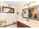Well-lit bathroom features a vanity with solid surface countertop and decorative mirror at 436 Maria Dr, Greenwood, IN 46143