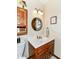 Cozy bathroom featuring a classic vanity, ample lighting, and practical fixtures for everyday use at 436 Maria Dr, Greenwood, IN 46143