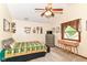 Cozy bedroom with vaulted ceiling features a ceiling fan, neutral walls, and carpet flooring at 436 Maria Dr, Greenwood, IN 46143