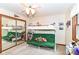 Bright bedroom features bunk beds, carpet, and a mirrored closet for added space at 436 Maria Dr, Greenwood, IN 46143