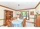 Formal dining room with a large window, wood trim, and classic furniture for elegant gatherings at 436 Maria Dr, Greenwood, IN 46143