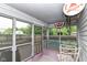 Relaxing screened patio with outdoor seating, decor, and view of the backyard at 436 Maria Dr, Greenwood, IN 46143