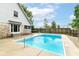 A private backyard oasis featuring a sparkling pool surrounded by lush greenery and a charming patio at 436 Maria Dr, Greenwood, IN 46143
