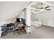 Finished attic space with white walls, a desk, and a ceiling fan at 4527 Central Ave, Indianapolis, IN 46205