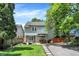 Inviting backyard featuring a stone patio, lush green lawn, and privacy fence—perfect for outdoor living at 4527 Central Ave, Indianapolis, IN 46205