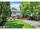 Inviting backyard featuring a stone patio, lush green lawn, and privacy fence—perfect for outdoor living at 4527 Central Ave, Indianapolis, IN 46205