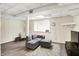 Finished basement featuring wood-look vinyl flooring, recessed lighting, and a cozy seating area at 4527 Central Ave, Indianapolis, IN 46205