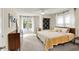 Bright bedroom with neutral walls, two windows, ceiling fan, and mid-century modern furniture at 4527 Central Ave, Indianapolis, IN 46205