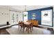 Bright dining room with blue accent wall, chandelier, and french doors at 4527 Central Ave, Indianapolis, IN 46205
