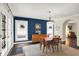 Elegant dining room with hardwood floors, table for four, and french doors at 4527 Central Ave, Indianapolis, IN 46205