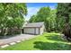 Detached two-car garage with mature landscaping and long driveway at 4527 Central Ave, Indianapolis, IN 46205