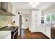 Bright kitchen with hardwood floors, stainless steel appliances, and a mosaic backsplash at 4527 Central Ave, Indianapolis, IN 46205
