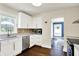 Bright kitchen featuring white cabinets, stainless steel appliances, and stylish backsplash, perfect for cooking at 4527 Central Ave, Indianapolis, IN 46205