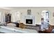 Bright living area featuring marble fireplace, sofa, and view of dining room at 4527 Central Ave, Indianapolis, IN 46205
