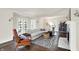 Spacious living room with fireplace, large windows, and hardwood floors at 4527 Central Ave, Indianapolis, IN 46205