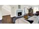 Living room with fireplace, arched entryway, and hardwood floors at 4527 Central Ave, Indianapolis, IN 46205