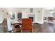 Open-concept living room with fireplace, comfortable seating, and arched doorways at 4527 Central Ave, Indianapolis, IN 46205