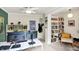 Office area with dual monitors, built-in shelving, decor, and a view into an adjacent room at 4527 Central Ave, Indianapolis, IN 46205