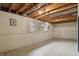 Unfinished basement featuring natural light and concrete floor at 5129 E 69Th St, Indianapolis, IN 46220