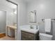 Bathroom with new vanity, updated fixtures, and a view to the adjacent water closet at 5129 E 69Th St, Indianapolis, IN 46220