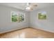 Bright bedroom with laminate wood flooring, large windows for natural light, and a neutral color scheme at 5129 E 69Th St, Indianapolis, IN 46220