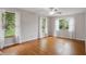 Airy bedroom featuring hardwood floors and large windows offering plenty of natural light and scenic views at 5129 E 69Th St, Indianapolis, IN 46220