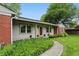 Charming single-story home with a manicured lawn and a combination of brick and light-colored siding at 5129 E 69Th St, Indianapolis, IN 46220