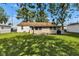 Expansive backyard showcasing lush green space and mature trees providing ample shade at 518 N Carr Rd, Plainfield, IN 46168