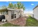 Backyard featuring a shed, patio, and grass area at 518 N Carr Rd, Plainfield, IN 46168