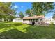 Spacious backyard featuring a well-maintained lawn, storage shed, and privacy fence at 518 N Carr Rd, Plainfield, IN 46168