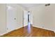 Spacious bedroom featuring hardwood floors and ample natural light from a large window at 518 N Carr Rd, Plainfield, IN 46168
